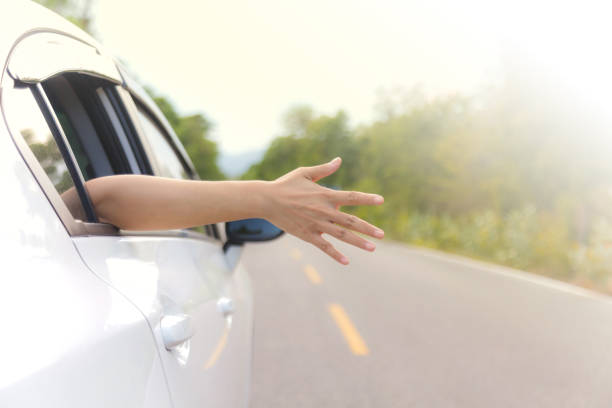 istock Woman hand at the car window 836102420