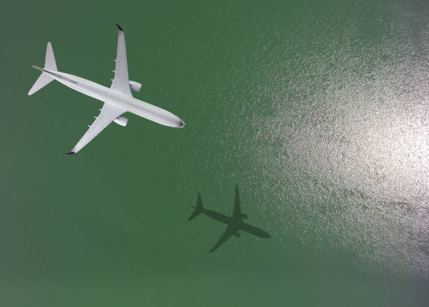 istock Airplane flies over a sea 836102538