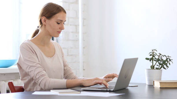 istock Beautiful Woman Working On Laptop in Office 836105462