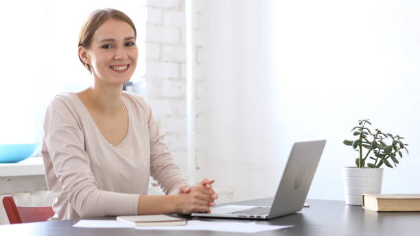 istock Relax woman Enjoying Work in Office, Smiling 836105600