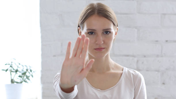 istock Beautifu Woman Gesturing Stop Sign with Hand 836105804
