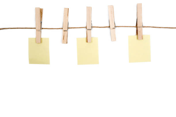 istock blank memo papers on rope with Clothespins, on white backgrounds, isolated. 836108900