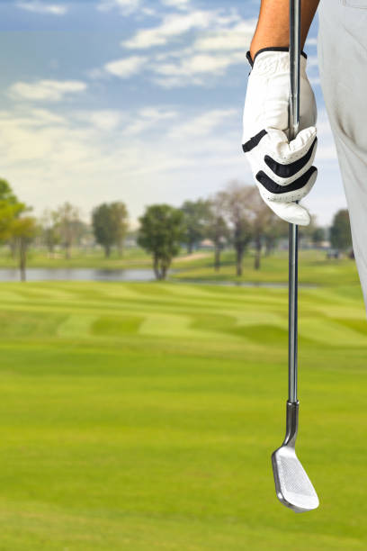 golf player holding a golf club - tee golf golf club ball imagens e fotografias de stock