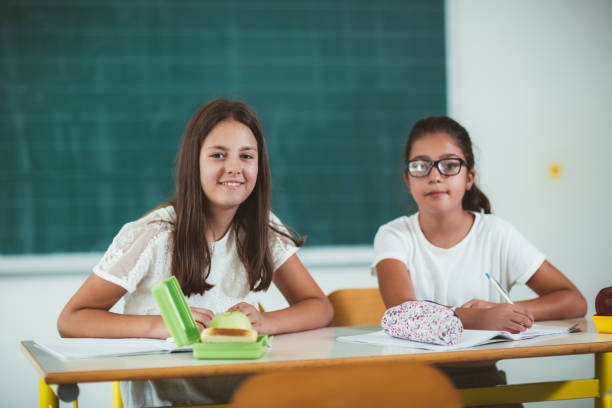 istock Two girls in the lunch break at the school 836112728