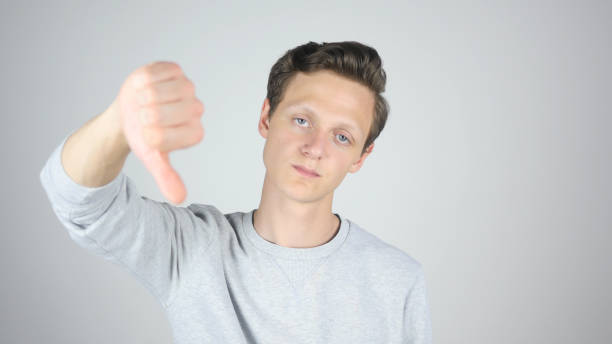 istock Thumbs Down, Failure, Disagree, Isolated Gesture by Young Man 836113336