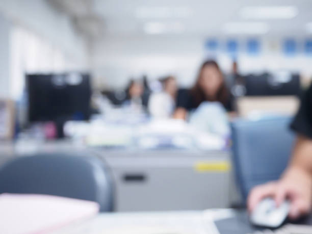 istock office blurred background with people working at desk 836116618
