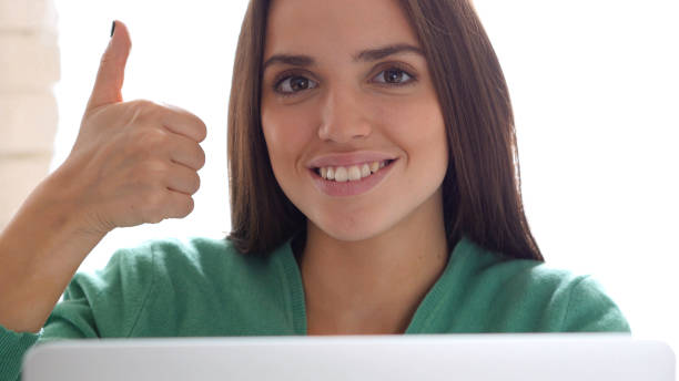 istock Thumbs Up by Creative Woman Sitting on Her Desk 836119648