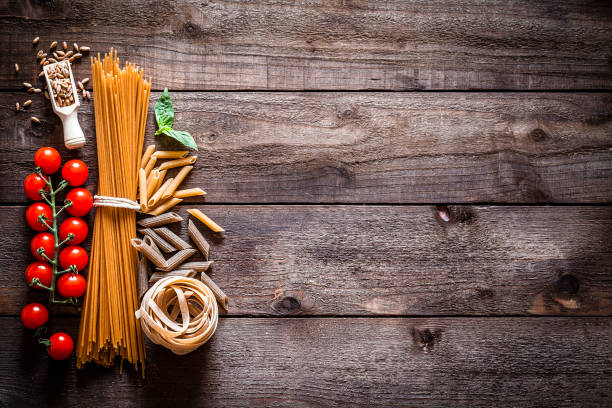 istock Wholegrain pasta and ingredients on rustic wooden table 836120048