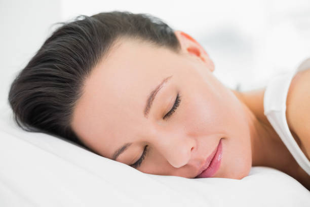 istock Pretty young woman sleeping in bed 836123588