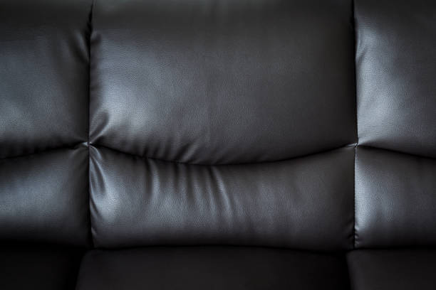 istock close up black leather sofa and textured and background with space. 836127552