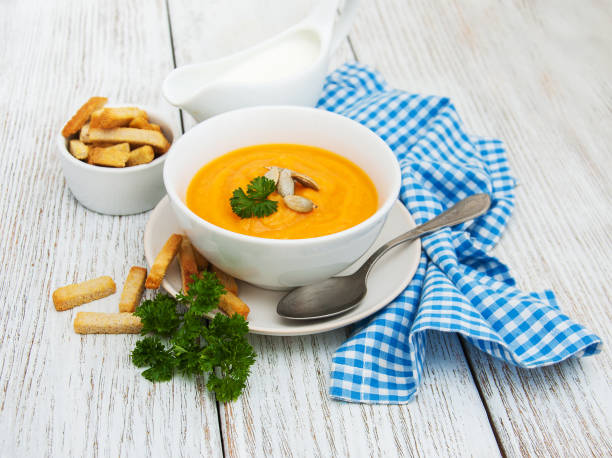 istock Pumpkin soup with fresh pumpkins 836128838