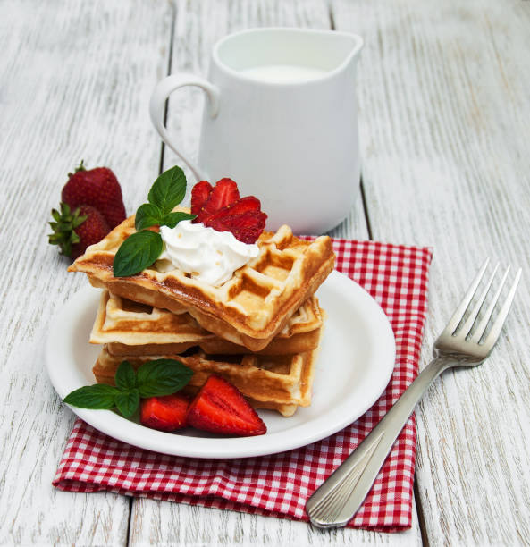 istock belgian waffles with strawberries and mint 836128862