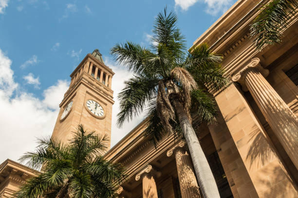 istock Brisbane City Hall with clock tower and palm trees 836130430
