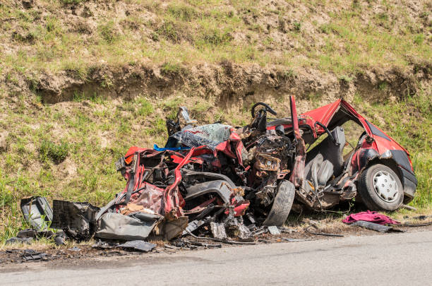 istock Unrecognizable car wreck beside a road 836138816