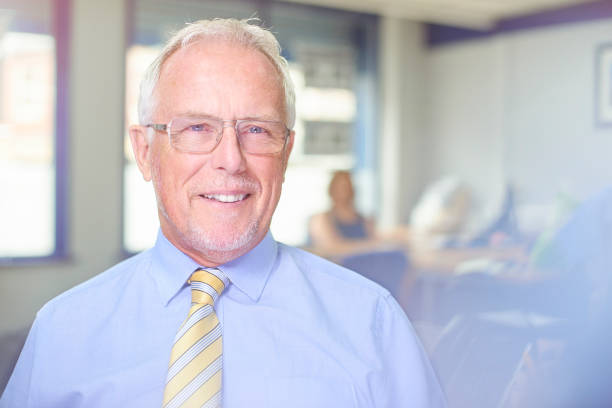 istock Senior businessman smiling to camera 836139504