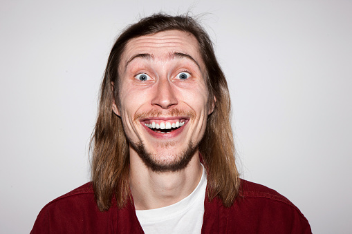 Positive astonishment. Surprised young male. Happy and good news for man, handsome guy portrait, facial expression concept