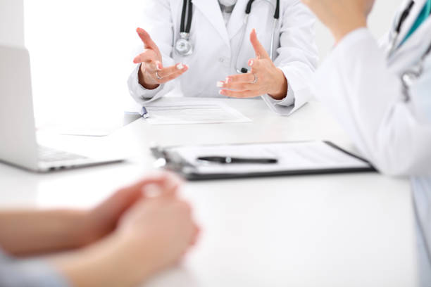 istock Doctor and patient are discussing something, just hands at the table 836154836