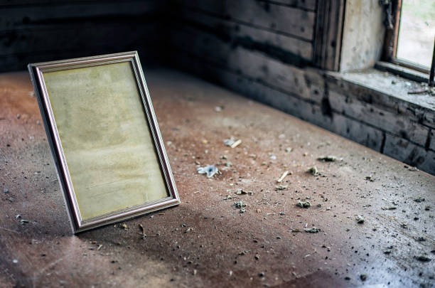 istock Old vintage photo frame at the table in abandoned room 836158692