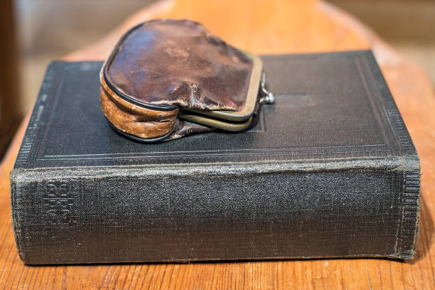 istock Old vintage leather purse on the black book 836158870