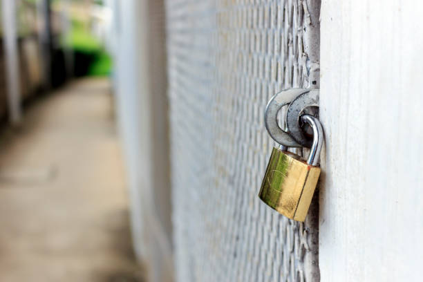 istock closeup old master key and rusty lock with soft-focus and over light 836159324