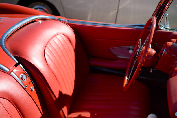 istock Steering wheel old car red seats 836159336
