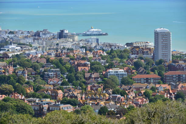 Looking down at the seaside town of Eastbourne in East Sussex. Looking down at the seaside town of Eastbourne in East Sussex. eastbourne pier photos stock pictures, royalty-free photos & images