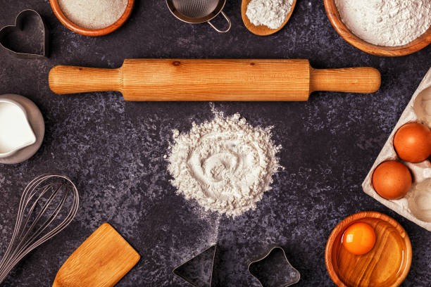 istock Ingredients for baking  - flour, wooden spoon, rolling pin, eggs. 836168024
