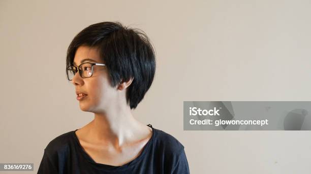Casual Asian Woman With Short Hair And Glasses On Color Background Stock  Photo - Download Image Now - iStock