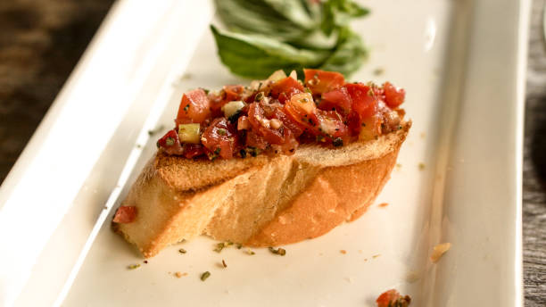 istock bruschetta appetizer at Italian restaurant. Summer tomatoes refresh food 836169408