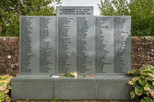 Lockerbie, Scotland, UK - August 19, 2017: The garden of remembrance for the victims of the Lockerbie air disaster in Dryfesdale cemetery, Lockerbie. The disaster happened on 21 December 1988 when a bomb exploded on board the Pan Am flight 103. All 243 passengers and 16 crew were killed as well as 11 people on the ground.