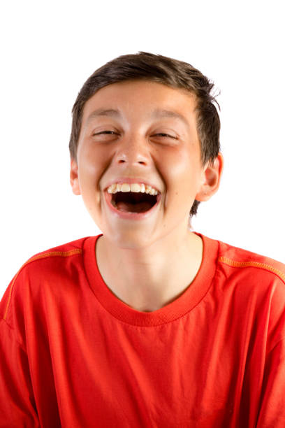 istock Young teenage boy isolated on white roaring with laughter 836180902
