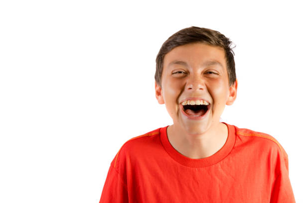 istock Young teenage boy isolated on white roaring with laughter 836183292