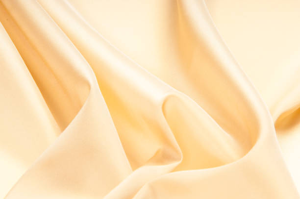istock satin fabric texture. beige color. 836184762