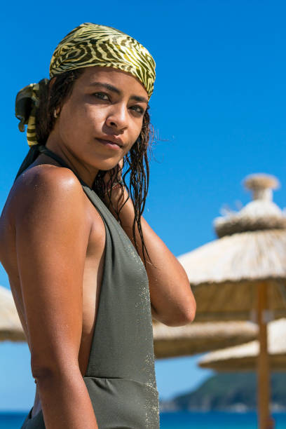 istock Stylish Young Woman Standing On A Beach 836185162