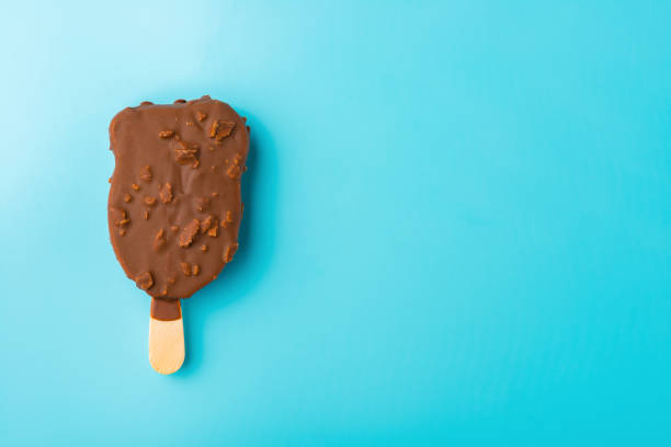 istock chocolate outer ice cream starts melting on a blue background 836185548