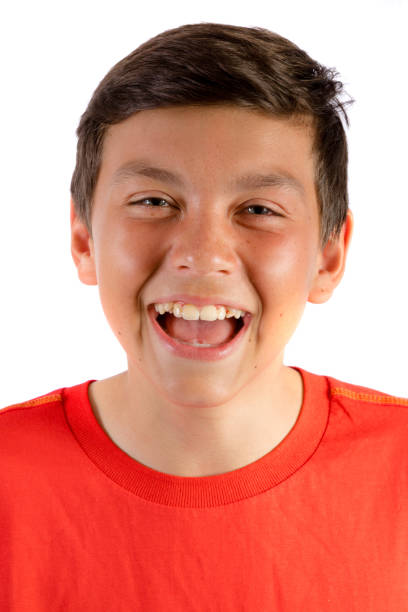 istock Young teenage boy isolated on white roaring with laughter 836185830