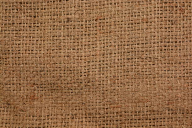 Closeup of Rustic jute sackcloth fabric as texture background Closeup of Rustic jute sackcloth fabric as texture background textured arts and entertainment on gunny stock pictures, royalty-free photos & images