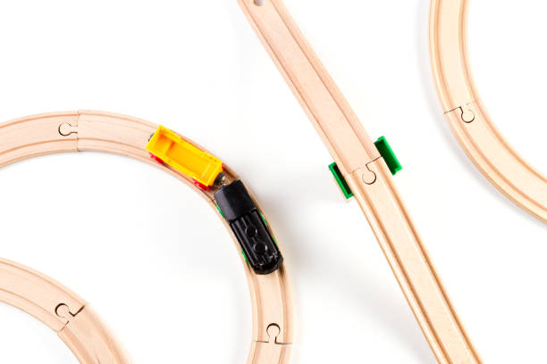istock Toy train and wooden rails on white background. Top view. 836195896
