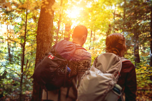 istock Young couple hiking in mountain on a footpath in Canada 836199818