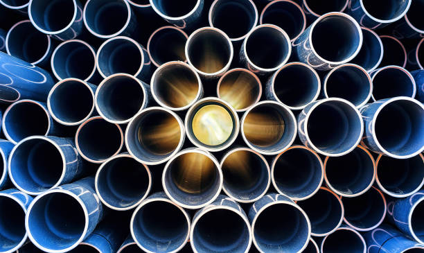 abstract pattern of aged pvc pipe with sun lights abstract pattern of aged pvc pipe with sun lights pvc conduit stock pictures, royalty-free photos & images