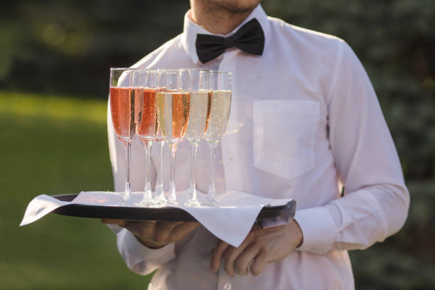istock Waiter serving champagne on a tray 836200806
