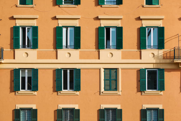 facade of an orange italian building - construction apartment house in a row imagens e fotografias de stock