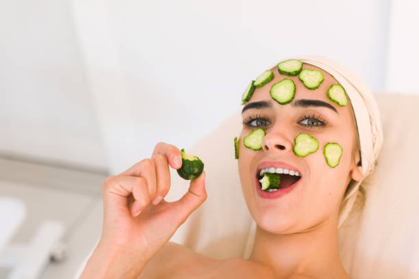 istock Girl is eating a cucumber 836201750