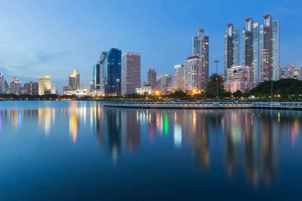 istock Twilight tone, City office and apartment building with water reflection 836202252