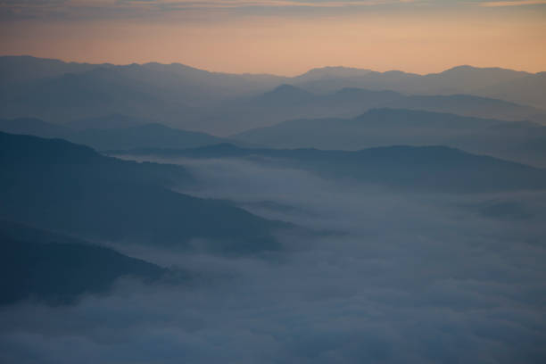 istock Layer of mountains and mist during sunset 836204742