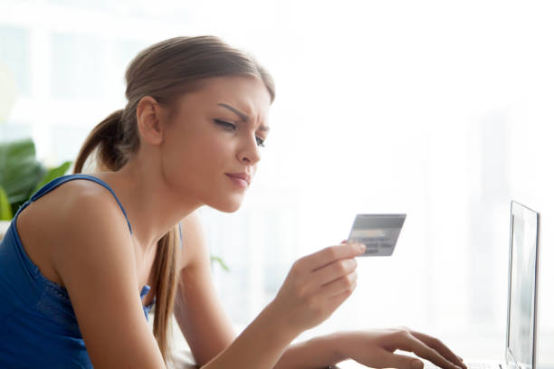 Lady typing credit card number when banking online