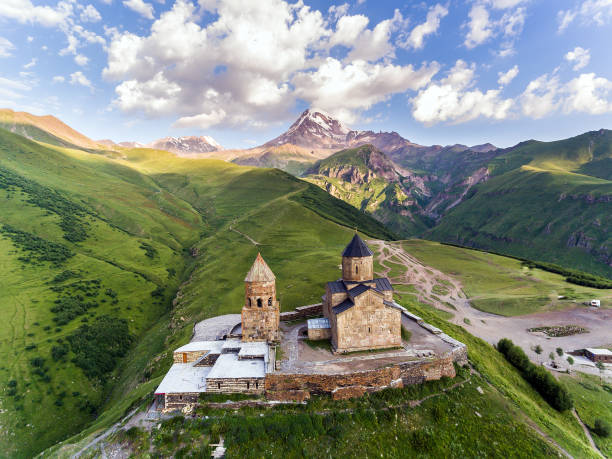 Gergeti Trinity Church Or Tsminda Sameba - Holy Trinity Church Near Village Of Gergeti In Georgia. Gergeti Trinity Church Or Tsminda Sameba - Holy Trinity Church Near Village Of Gergeti In Georgia caucasus stock pictures, royalty-free photos & images