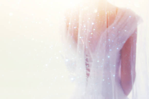 istock Dreamy abstract and blurry background of beautiful bride with wedding dress, from behind 836240708
