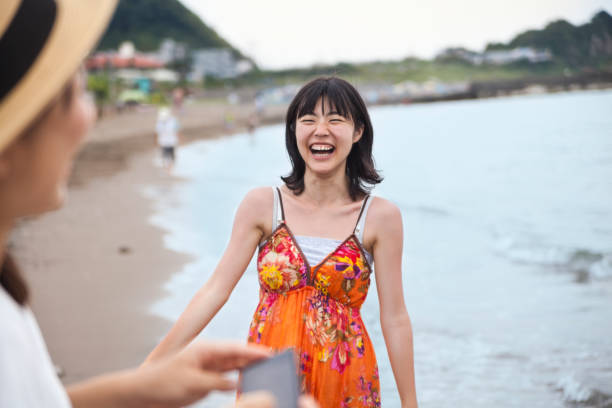 istock Two Young Women Having Fun At The Beach 836244614