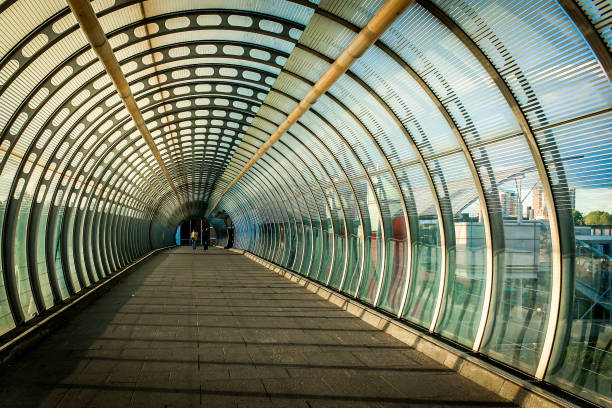 istock Vortex like Pedestrian bridge built two women friends walking 836248304